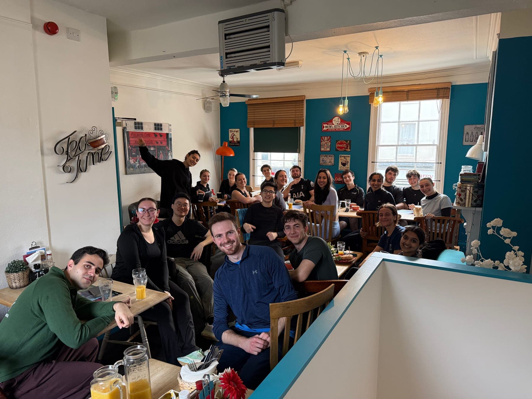 Runners filling the tables inside a café after a run